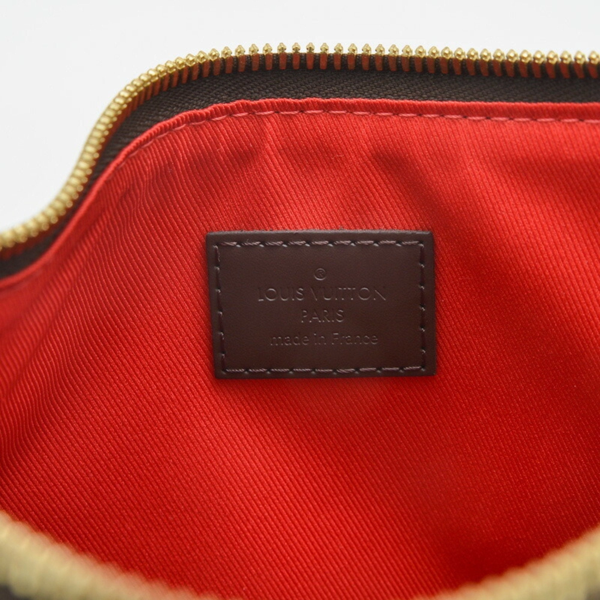 Elegant Canvas Shoulder Bag with Charm and Dust Bag Inclusion