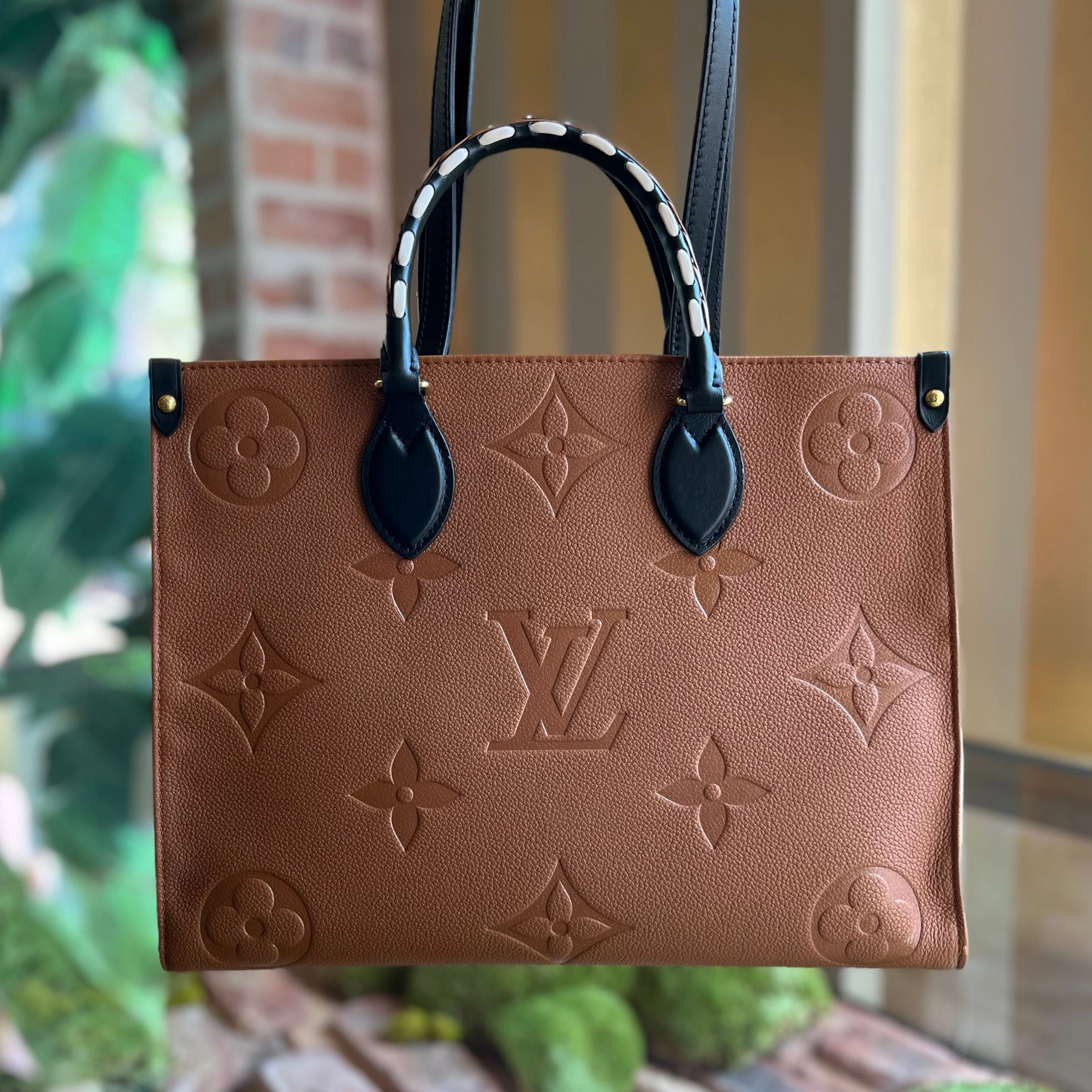 LOUIS VUITTON Onthego MM Brown Empreinte Monogram Giant Wild At Heart Tote Bag