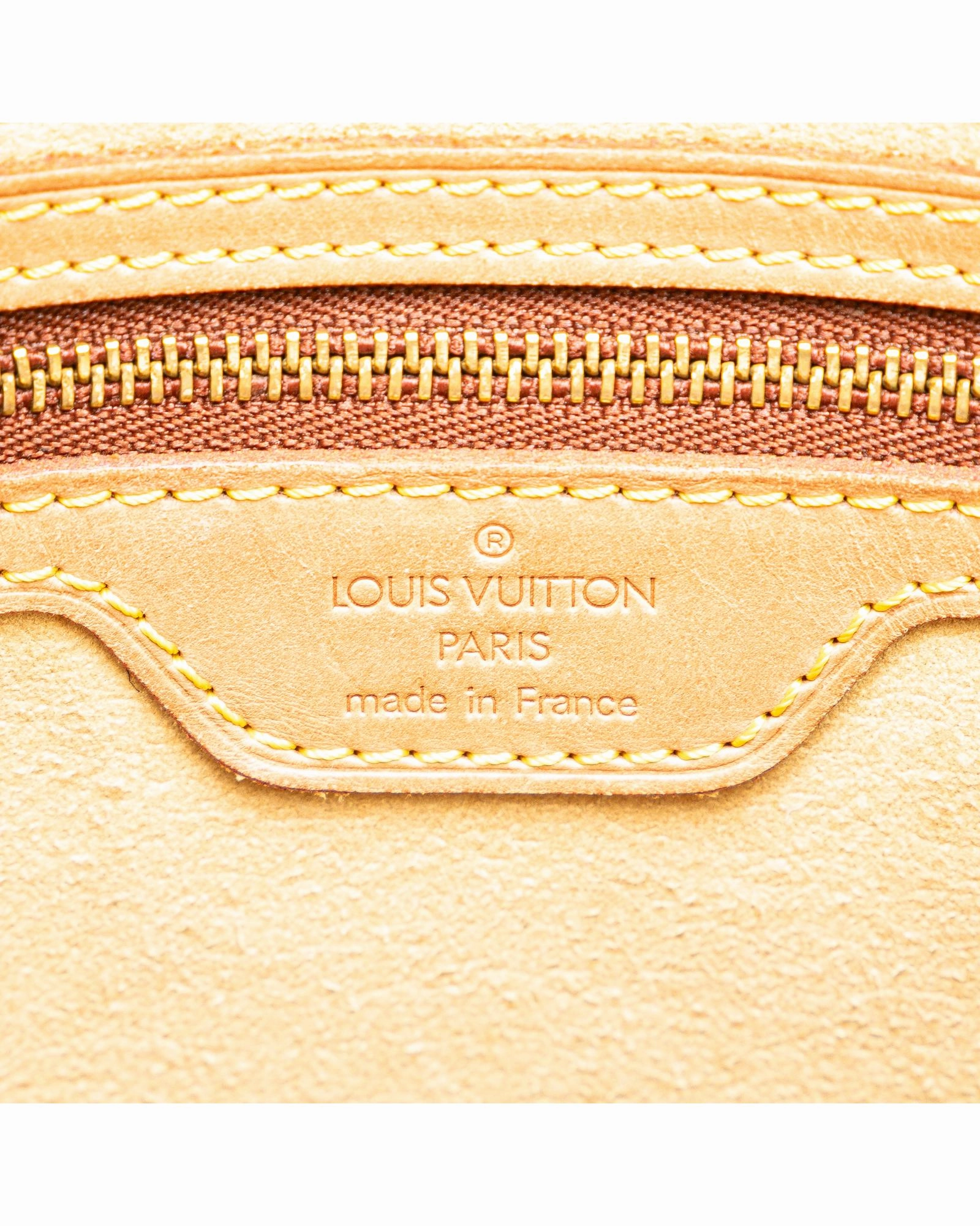 Monogram Canvas Shoulder Bag with Vachetta Leather Strap and Top Zip Closure